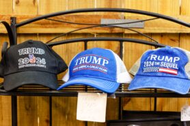 Commonwealth Round Table Jourfnal Opinion Trump and America’s tipping point. picture shows Donald Trump campaign hats in 2024